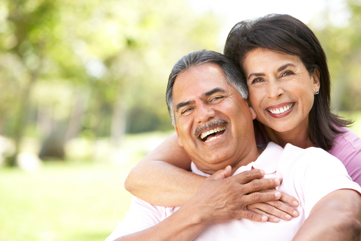 Portrait-Of-Senior-Couple-In-Park-93469681_724x482